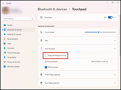 Touchpad settings screen with the Drag two fingers to scroll check box indicated in the "Scroll & zoom" section.